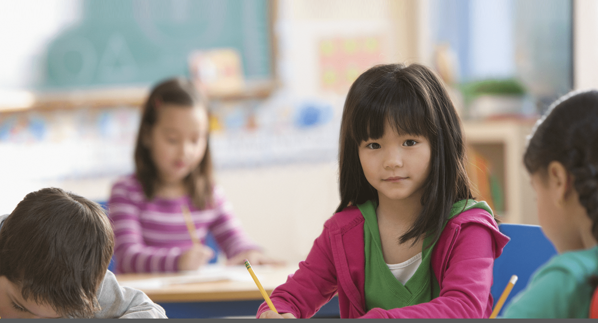 Kids writing with pencils