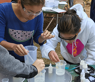 Two girls working on a science project