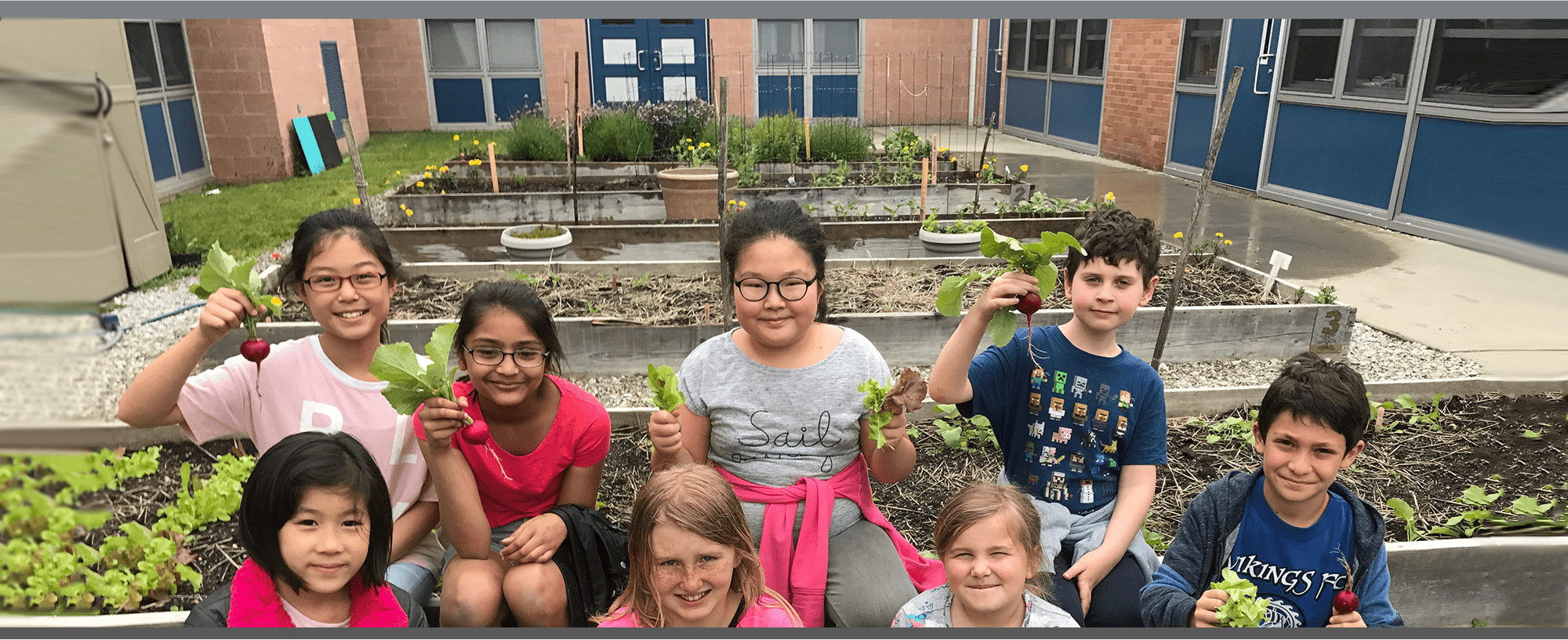 students holding radishes