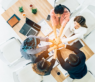 Group of board members working as a team at a table